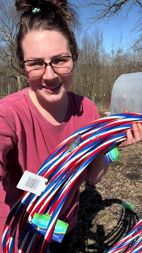 Dollar Tree Hula Hoop Low Tunnels! I do plan on covering the front and back as well. I did add a stake on the front and back to help hold and center the plastic. I am excited to see how these work this year and start some things early outside! #backyardgarden #dollartree #gardening #garden #gardeningtips #gardeninspiration #gardeninglife #gardendiy #homestead #homesteading