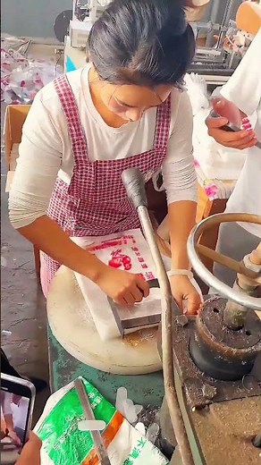 Efficient Food Packaging: Manually Sealing Bags at Speed