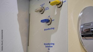 Slow motion tilting shot revealing the cleaning stages on a colon hydrotherapy machine