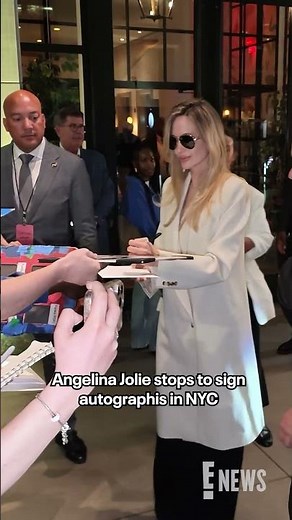 Angelina Jolie stopped for fans to sign autographs as she left a screening of her new film "Couture"