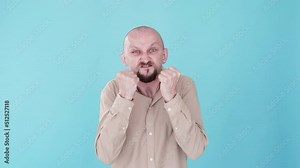 Hate emotion. Mad guy. Boomerang animation. Aggression breakdown. Angry furious man threatening clenching fists swearing cursing gif loop isolated on blue copy space background.