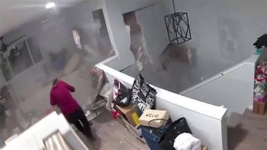 Video shows terrifying moment boulder crashes into Honolulu home and nearly strikes woman