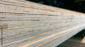 Stacks of Plywood Sheets Stored at a Woodworking Factory. Close-Up View
