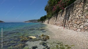 Kas, Turkey - 4th of July 2022: 4K Natural pebble beach of Kas gulf