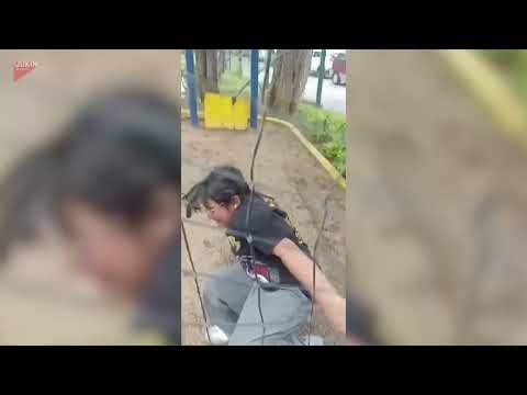 Girl Enjoys Zip Line Ride and Ends With Playful Tumble - 1833001