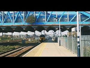 Class 57 Diesel Locomotive heading through Peterborough Station platform 1.
