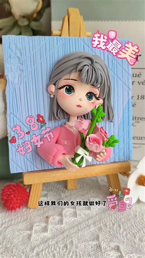 Watch this adorable handmade clay girl wearing a pink jacket 💗