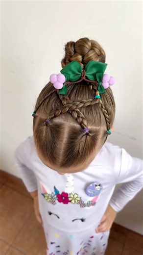Tetiana Brezinska | A fairy-tale braid masterpiece ✨🌸 Turning simple strands into pure magic! 💖🌿 #KidsHairstyle #BraidedBun #CreativeBraids... | Instagram