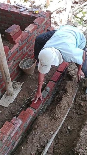 Straighten and align the brickwork with the guide string.