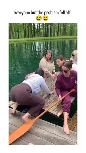 DEEPAK HAMAL on Instagram: "This Viral Instagram reel shares a 13-second video of friends on a precarious floating picnic table in a pond, where a sudden tip sends everyone splashing into the water except one woman who clings on calmly, captioned "everyone but the problem fell off" to poke fun at her as the group's troublemaker. Uploaded by @HumansNoContext ,a popular account curating bizarre human moments without explanation, the clip exploded with 1.25 million views and nearly 10,000 likes in 