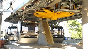 Rotating yellow wheel on ropeway mashine station