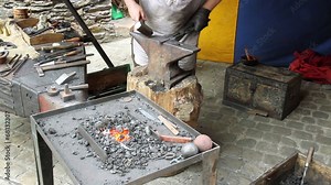 Blacksmith. Medieval tradition of making armor at the forge. Stock Video