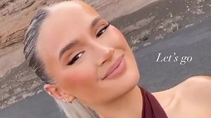 Busty Molly-Mae looks stunning in a plunging top as she reveals glam makeover