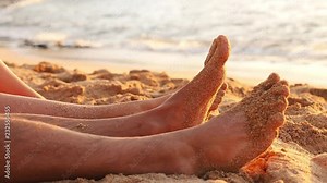 Sandy feet playing in the sand Stock Video