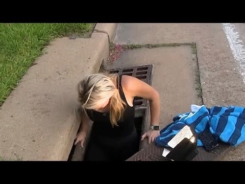 Brave Woman Crawls Through Storm Drains to Rescue Puppies