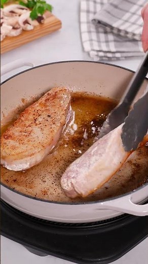 Smothered pork chops in rich onion mushroom gravy. #porkchops #easyrecipes