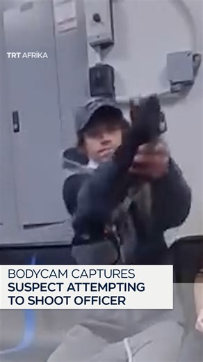 TRT Afrika on Instagram: "Body camera footage captures a tense moment inside an Ohio Walmart security room, where a shoplifting suspect allegedly attempted to shoot a police officer at point-blank range. Police say the suspect pulled a gun and pulled the trigger twice, but the weapon appeared to malfunction. A Walmart security worker intervened, knocking the gun away as the officer moved in to restrain the suspect. The suspect was taken into custody and later charged with attempted murder and fe
