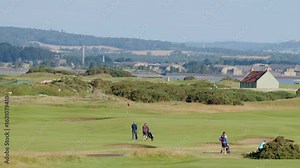 Golfers Walking Across Fairway at St Andrews Course