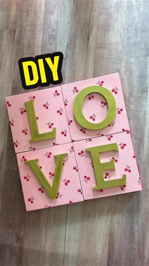 DIY Valentine Home Decor Craft! I’m doing decoupage with Mid Podge. Using cherry scrapbook paper and wood canvases. I love this cute LOVE art… it’s perfect for Valentine’s Day or any day! #crafts #decoupage #tutorials