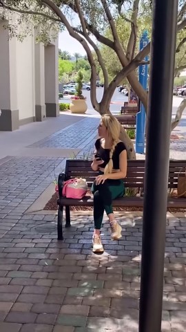 Woman pranks her friend in outside mall