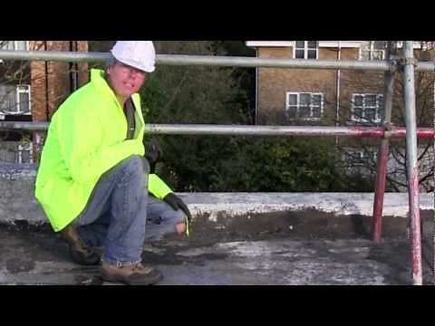 Preparing an old asphalt roof for covering with a liquid flat roofing system.