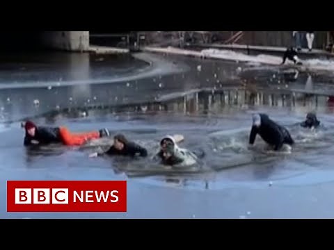 Group of skaters rescued after falling through ice - BBC News