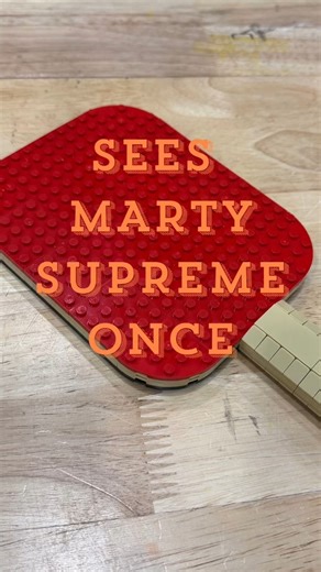 Nathan Sawaya | Art Of The Brick on Instagram: "Built a table tennis racket from LEGO. 🏓🧱 In honor of Marty Supreme. Play is powerful."