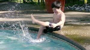 Boy Splashing Pool Slow Motion Hd Stock Footage Video (100% Royalty-free) 2250415 | Shutterstock