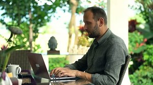 Young Man Using Laptop Sitting By Stock Footage Video (100% Royalty-free) 22732546 | Shutterstock