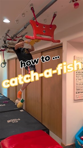 Reel and catch-a-fish and enter it in the slot to the bucket 🐠 #ninjawarrior #ninja #obstaclecourse #newchallenge #trending #kidsactivitiesideas #fitnessfun | Tyler.Ninja.Bowers