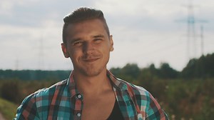 Young man with an open shirt smiling - Free Stock Video