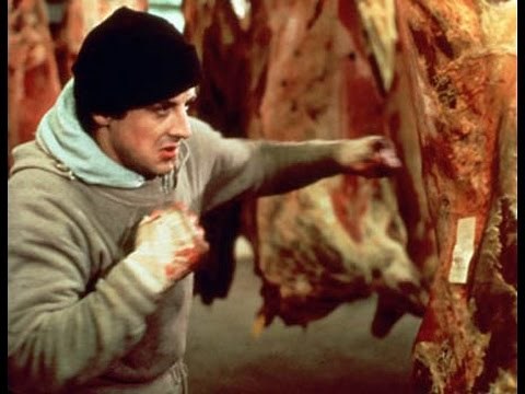 Rocky (1976): Rocky punches meat
