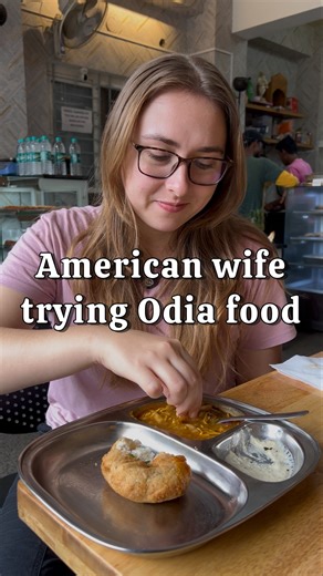 Odia food makes her happy! ♥️ [Deepak and Hannah, Odia food, Ghuguni bora, Odia culture, Odisha cuisine, American wife, Inter cultural couple, Indian American couple, Indian food review] #husbandwife #interculturalcouple #foreignerinindia #multiculturalcouple #bangalore #lifeinindia #indianamerican #deepakandhannah #healthyrelationship #famousfood #odiafood #odishafood #foodreview #odiafoodblogger #foodoftheday | Deepak and Hannah
