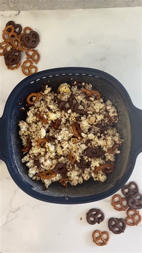 🥨 Happy National Pretzel Day! 🎉 Get ready to twist and shout because we're celebrating with our delicious Chocolate Pretzel Popcorn recipe that'll leave you craving more! 😋✨ Here's what you'll need: 🥨¼ cup popcorn kernels 🥨4 oz. semisweet baking bar, chopped 🥨½ cup pretzels, crumbled 🥨Pinch of salt Extend Tupperware WOW Pop Microwave Popcorn Maker and add kernels inside. Cover and microwave for 2 minutes. Remove from microwave and remove any unpopped kernels by shaking them out. Quickly a