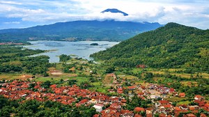 Mount Cereme landscape with rice fields and forested hills