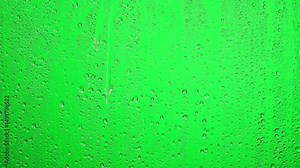 Rain drops on glass window, Rain falling green screen water drops on screen - water splashes on window glass