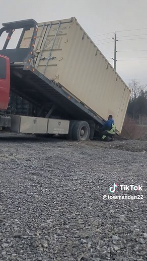 Walking My Truck Under This Container Heavy shipping container move. Had to back under it to a certain point and then walk the truck under it. Here’s what that means: • Push the deck down • Lift the rear wheels off the ground • Pull the deck in • Wheels slide back • Then manually slide the deck under the container until it reaches the locking pins It looks strange if you’ve never seen it before — but it’s a great trick for onsite container moves. No crane needed. #WorkSmart #TowLife #towmandan #