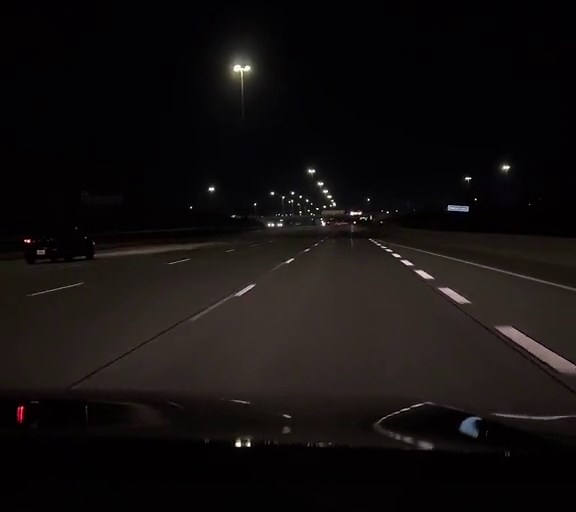 Nighttime Highway Drive Aesthetic with Urban Lights