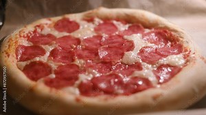 Time lapse video of baking pizza with salami pepperoni in a home electric oven. Pizza with salami in hot oven close up. Time lapse. UHD 4k video