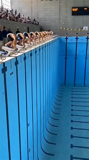 At the Olympic swimming event, spectators are stunned when athletes appear to dive toward what looks like a solid surface. Seconds later, it’s revealed to be a special transparent platform installed for a dramatic opening ceremony effect. The swimmers land safely and stand up smiling as the crowd realizes it’s part of a staged performance. Coaches join the celebration poolside, turning the shocking visual into a viral Olympic moment shared across global sports media. #Olympics #Swimming #Olympic