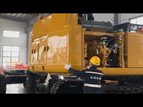 Caterpillar 349 excavator installing counterweight