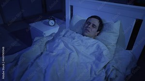 Scared man woke up from a nightmare