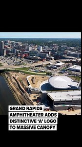 🔗: https://l.mlive.com/kmi8da A distinctive triangular logo with an ‘A’ now adorns the canopy roof of downtown Grand Rapids’ newest entertainment venue, marking another milestone in the construction of the $184 million Acrisure Amphitheater. The logo, visible only from above, represents Acrisure, the Grand Rapids-based financial technology firm that secured the naming rights for the riverfront amphitheater with a $30 million contribution to the project. | MLive.com