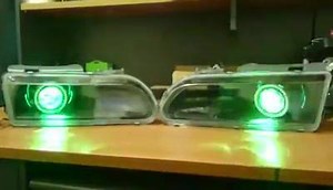 VR/VS commodore headlights fully blacked out fitted with projector(low plus high beam) with multicoloured devil eyes and multicoloured halo rings :-) | Dan's Custom Car Lights