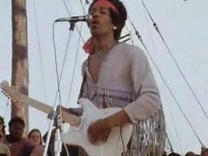 Jimi Hendrix - "Message To Love" - "Live At Woodstock" (1969) [Background vocal:] Yeah, ooo Well I travel at the speed of a reborn man I got a lot of love to give From the mirrors of my hand I sent a message of love Don't you run away Look at your heart baby Come on along with me today Well I am what I am thank god Some people just don't understand Well help them god Find yourselef first And then your tool Find yourself first Don't you be no fool Here comes a woman Wrapped up in chan Messin' wit