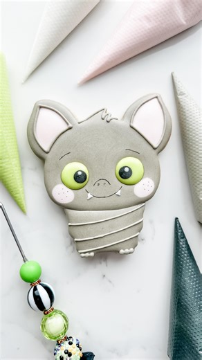 Mandy Edmunds on Instagram: "Learn to decorate an adorable bat cookie with me! You can buy your own “Eek Bat”cookie cutter from @kaleidacuts and she sells STL files so you can 3D print your own at home (like I did!) Here’s what royal icing colors and consistencies you need: - Americolor Taupe, piping and hybrid - Americolor Soft Pink, hybrid - Americolor Electric Green, hybrid - Americolor Super Black, hybrid - White, piping Tips: Find my Signature Vanilla cookie recipe and Royal Icing recipes p