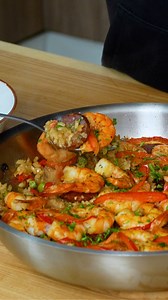 Quick and easy recipe Paella baked sausage and shrimp! Ingredients: shrimps: 400 g (14 oz) onion: 150 g (5.3 oz) red bell pepper: 80 g (2.8 oz) garlic: 3 cloves parsley: 5 g (0.2 oz) spicy salami: 200 g (7.1 oz) olive oil: 1 tbsps sweet paprika: 0.5 tsps chicken broth: 400 ml (14 fl oz) vegetable oil: 1 tbsps sweet paprika: 0.5 tsps round grain rice: 100 g (3.5 oz) frozen green peas: 80 g (2.8 oz) salt and black pepper to taste: 80 g (2.8 oz) sweet paprika: bouillon: 300 ml (10 fl oz) lemon: par