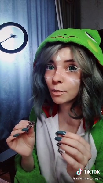 Frog-Inspired Fashion Performance in Festive Home Setting