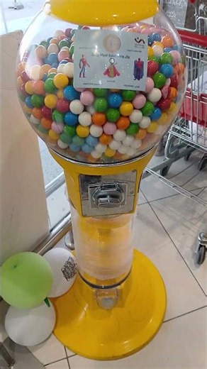Insert coin and get yellow white gumballs candy machine dispenser #shorts