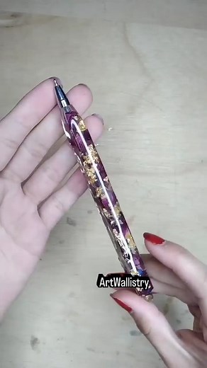A classy refillable resin pen filled with real dry red petals—a...